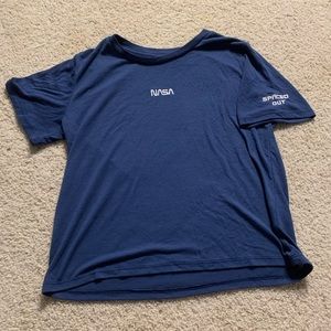 Blue short sleeve shirt with “NASA” on it